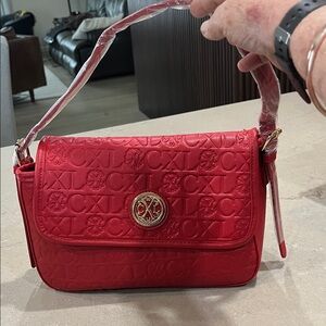 Red Embossed Shoulder Bag with Gold Emblem